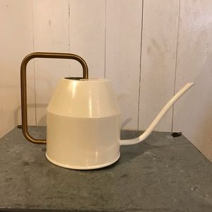 Small white watering can